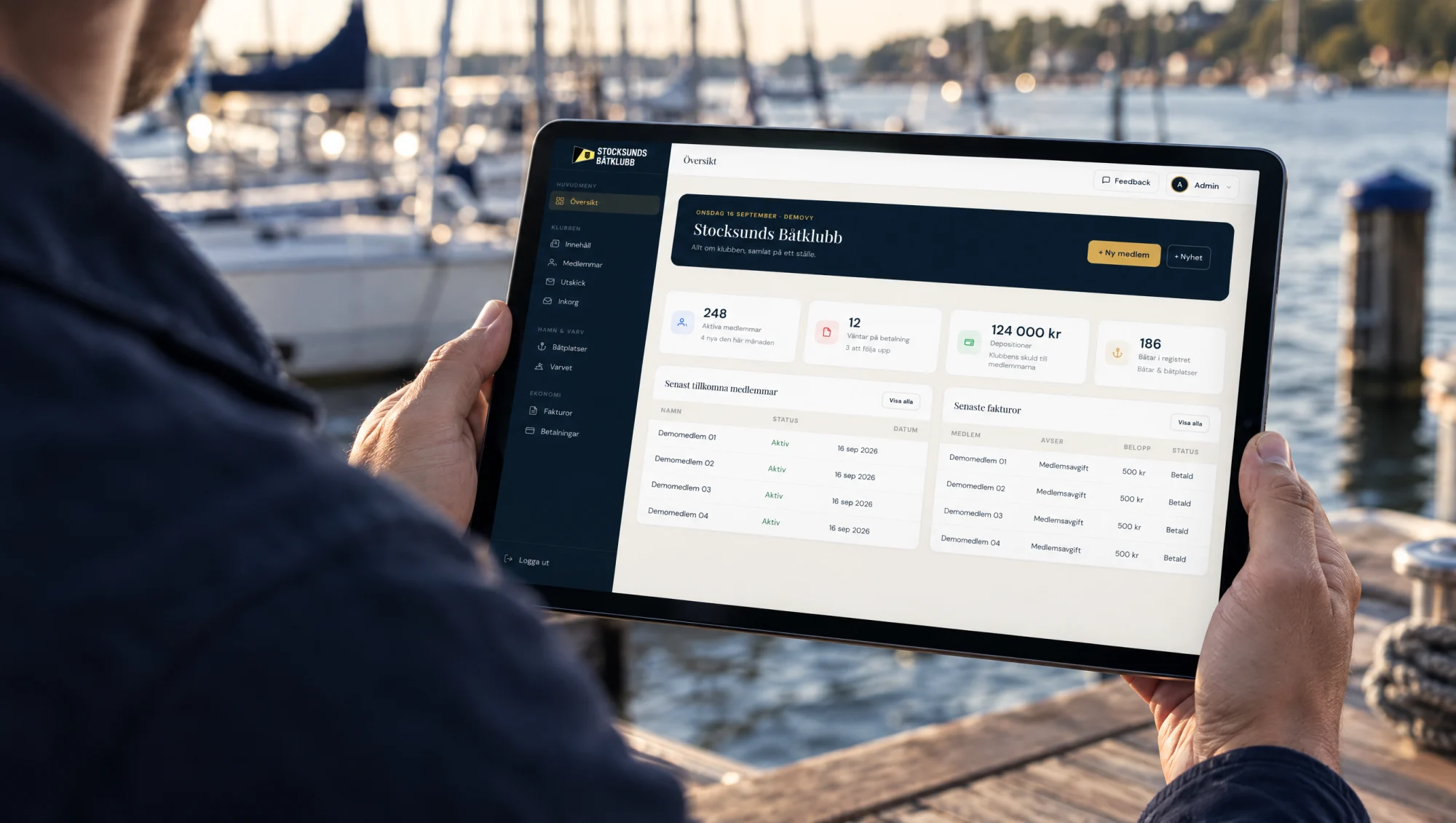 Illustrative scene of the real administration interface on an iPad by the harbour, using demo data