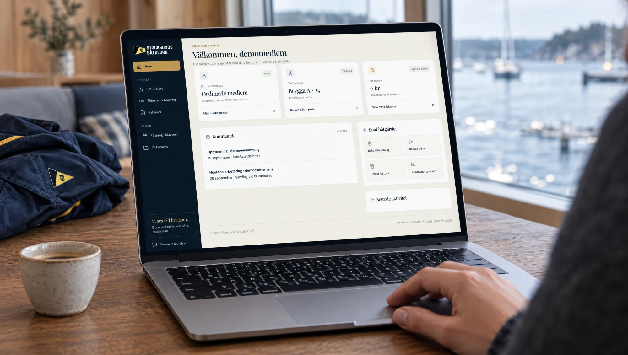 Illustrative laptop scene showing the actual Mina sidor member portal with demo data